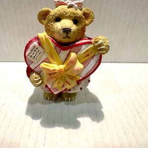 Teddy Bear Figurine Holding Heart with Yellow Bow